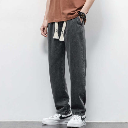 Men's Summer Loose Wide Leg Drawstring Jeans displaying premium lightweight breathable denim fabric texture under macro light