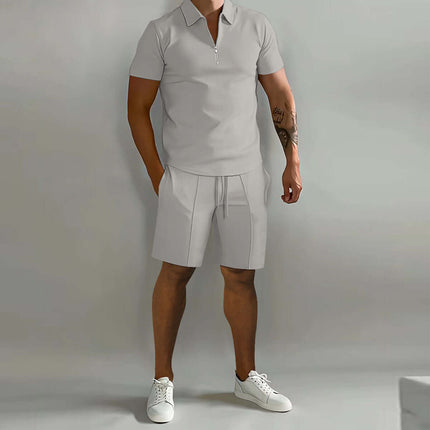 Mens Summer Polo Shirt And Drawstring Shorts Set featuring a light grey polo and matching shorts, styled with white sneakers.