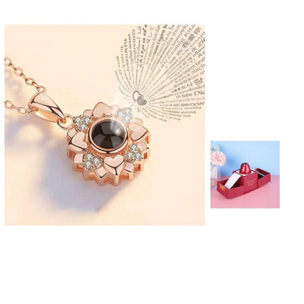 Metal Rose Jewelry Gift Box with Crystal Necklace featuring a stylish pendant with a dark stone and floral accents.