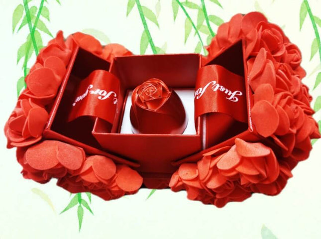 Metal Rose Jewelry Gift Box with Crystal Necklace featuring a decorative rose and red petals.