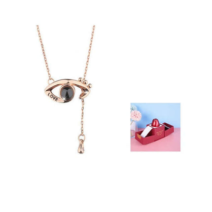 Metal Rose Jewelry Gift Box with Crystal Necklace showcasing elegant necklace with eye design and crystal pendant.