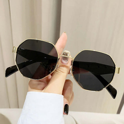 Modern Square Polygon Metal Sunglasses Full Frame UV400 held in hand, featuring sleek gold accents and dark lenses.