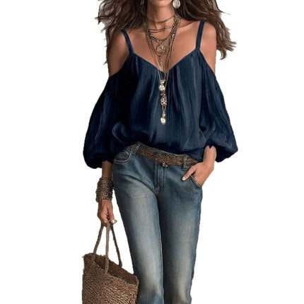 Model wearing an Off Shoulder Strapless Bubble Sleeved Resort Blouse with denim jeans and accessories.