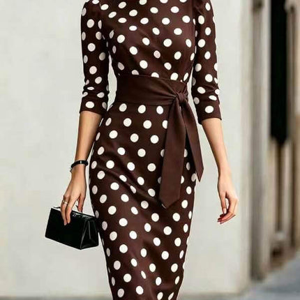 Polka Dot Belted Midi Pencil Dress For Women modeled by a woman in a stylish urban setting.