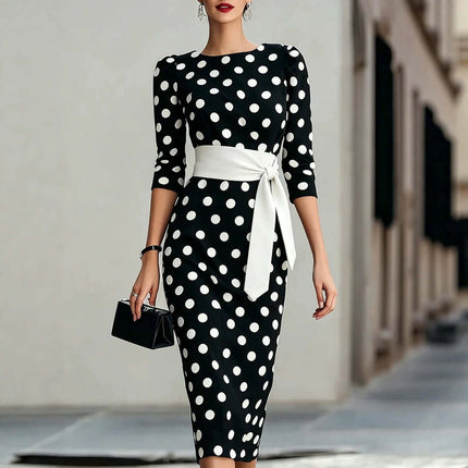 Polka Dot Belted Midi Pencil Dress For Women in a stylish outdoor setting, showcasing the black and white design.