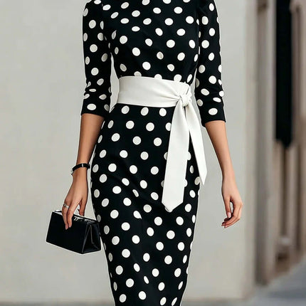 Polka Dot Belted Midi Pencil Dress For Women worn by a model with a stylish black and white polka dot pattern.