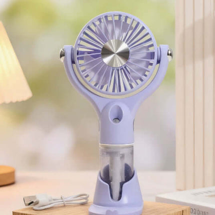 Portable Handheld Spray Fan 4 Speed Water Spray Mist Fan in lavender color with mist function and USB charging.