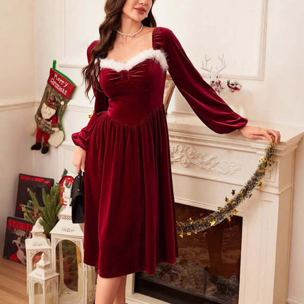 Red Velvet Square Neck Long Sleeve Maxi Dress worn by a model in a cozy setting with festive decorations.