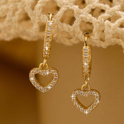 Retro Heart-shaped Pendant Ring Zircon Earrings in gold with sparkling details and heart shape design.