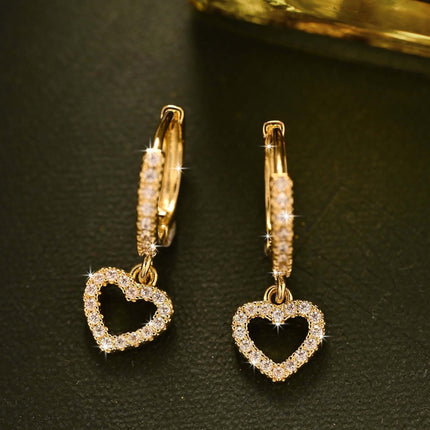 Retro Heart-shaped Pendant Ring Zircon Earrings featuring sparkling heart designs in gold.