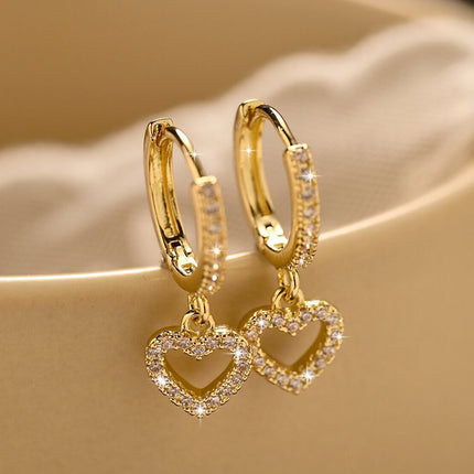 Retro Heart-shaped Pendant Ring Zircon Earrings displayed against a soft background in a gold finish.