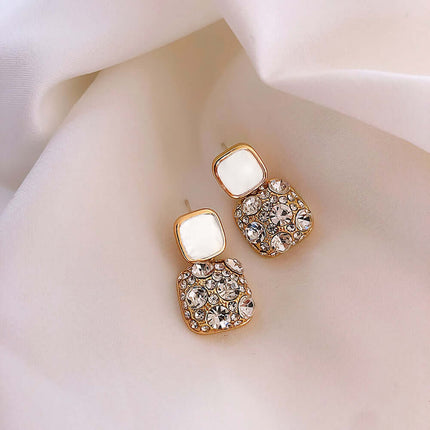Rhinestone Cube Geometric Earrings Ins Fashion Jewelry displayed on soft fabric.