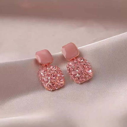 Rhinestone Cube Geometric Earrings Ins Fashion Jewelry in pink color on a silky background.