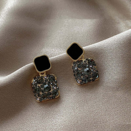 Rhinestone Cube Geometric Earrings Ins Fashion Jewelry on a silky background.