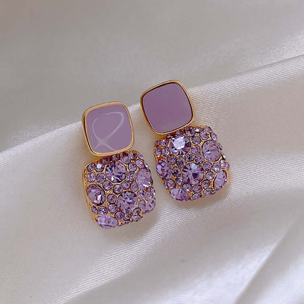 Rhinestone Cube Geometric Earrings Ins Fashion Jewelry featuring lilac and gold accents on a satin background.