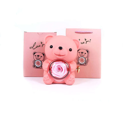 Rotating Bear Gift Box featuring a pink bear holding an eternal rose, perfect for romantic gifts and anniversaries.