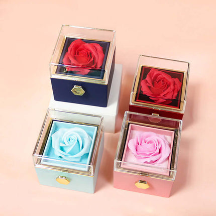 Rotating Rose Jewelry Box in blue color with matching gift bag.