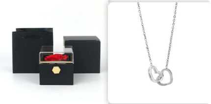 Rotating Rose Jewelry Box with Eternal Soap Flower next to a silver necklace in a gift box.