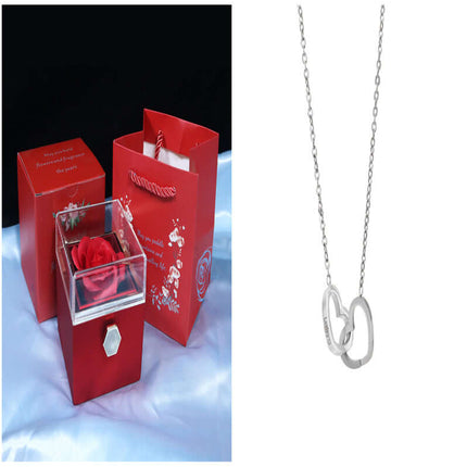 Rotating Rose Jewelry Box with Eternal Soap Flower and a silver heart necklace.