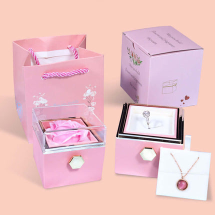 Rotating Rose Jewelry Box in pink color for romantic gifts.