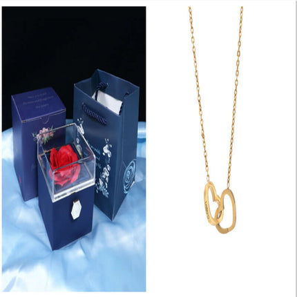 Rotating Rose Jewelry Box with Eternal Soap Flower and a delicate gold necklace, perfect for romantic gifts.