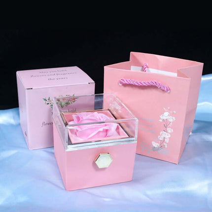 Rotating Rose Jewelry Box being held in hand to show size scale.