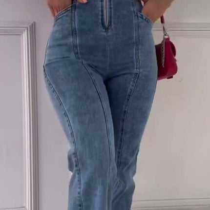 Sleeveless Paneled Zipper Denim Jumpsuit on a model, featuring a zipper front and side pockets.
