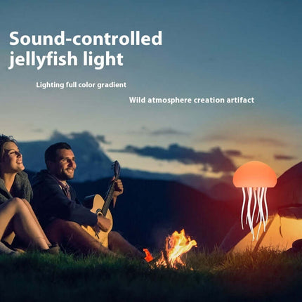 Smart LED Jellyfish Mood Lamp and Night Light creating a vibrant atmosphere around a campfire.