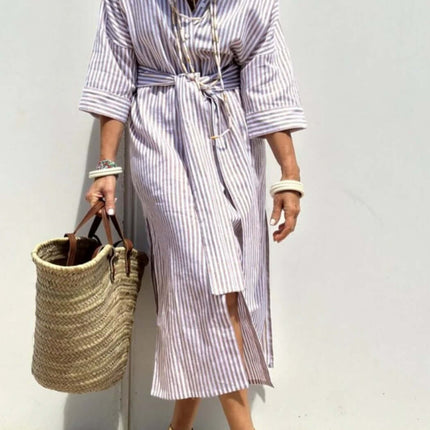 Striped Half-Sleeve Belted Lapel Shirt Dress worn by a woman with a tote bag and stylish sandals.