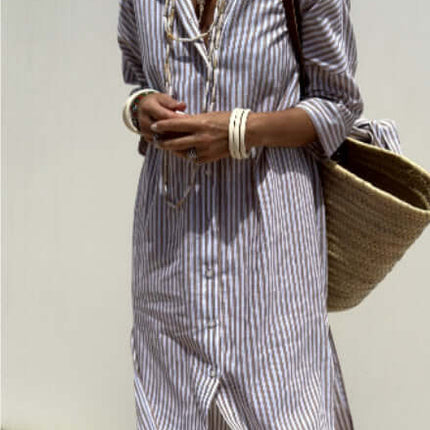 Striped Half-Sleeve Belted Lapel Shirt Dress worn with accessories and a wicker bag in a sunny outdoor setting.