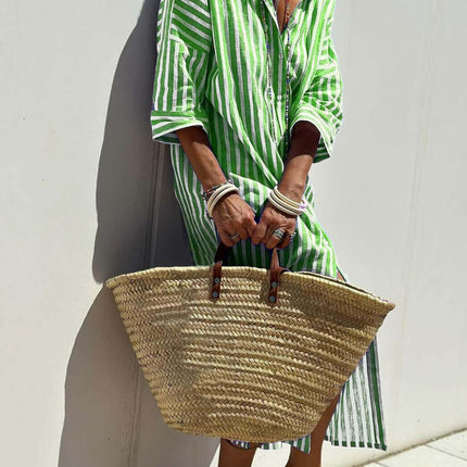 Striped Half-Sleeve Belted Lapel Shirt Dress in green, paired with a woven straw bag, perfect for summer style.