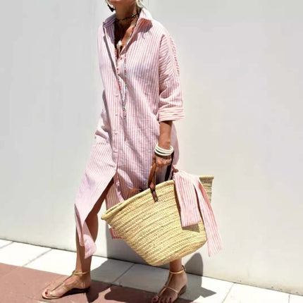 Woman wearing a Striped Half-Sleeve Belted Lapel Shirt Dress with a straw bag in a sunny outdoor setting.