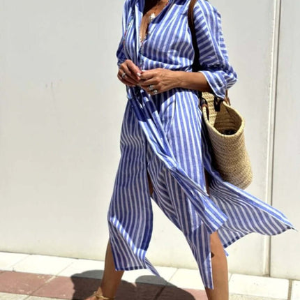 Woman wearing a Striped Half-Sleeve Belted Lapel Shirt Dress, walking outdoors with a straw bag.