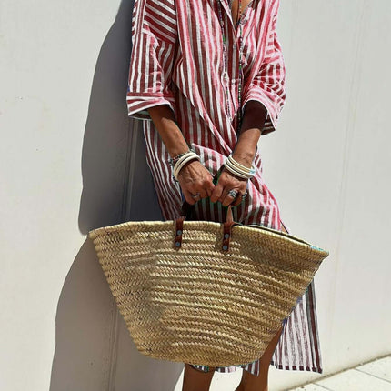 Striped Half-Sleeve Belted Lapel Shirt Dress styled with a woven straw bag, perfect for summer outings.