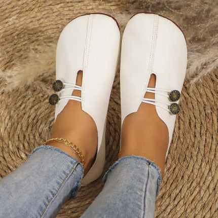 Summer Fashion Square Toe Slip-on Flat Sandals in white worn with denim jeans.