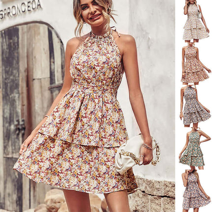 Summer Printed Halter Backless Ruffled A-Line Beach Dress worn by a smiling woman with floral patterns.