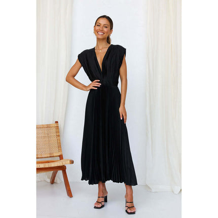 Woman wearing Summer V Neck Pleated Sleeveless Maxi Dress in black, standing against a light background.