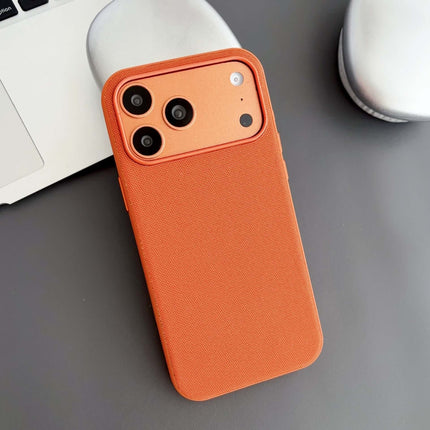 Tech Fabric Magnetic MagSafe Case Compatible iPhone in orange color on a table next to a laptop.