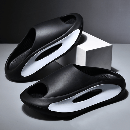 Unisex Hollow Peep Toe Summer EVA Slides in black and white design, showcased on a minimalistic background.