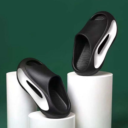 Unisex Hollow Peep Toe Summer EVA Slides on display against a green background, showcasing a stylish and modern design.