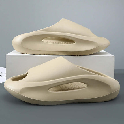Unisex Hollow Peep Toe Summer EVA Slides in beige color, showcasing their unique design on a display surface.