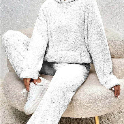 Winter Plush Pajama Set Fashion Hooded Top and Pants on a model sitting in a cozy chair.