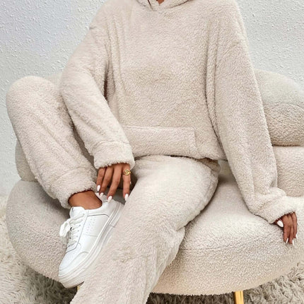 Winter Plush Pajama Set Fashion Hooded Top and Pants in cozy beige worn while sitting on a stylish chair.