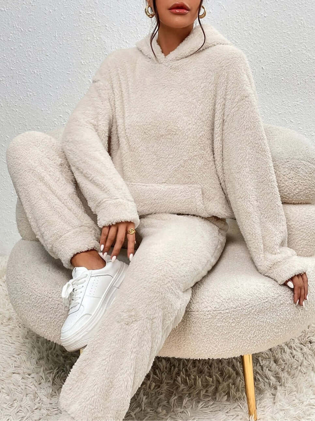 Winter Plush Pajama Set Fashion Hooded Top and Pants in cozy beige worn while sitting on a stylish chair.