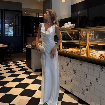 Women Fashion French Style Sleeveless V-Neck Dress worn by a model in a chic café setting.