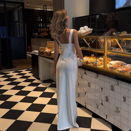 Women Fashion French Style Sleeveless V-Neck Dress worn by a woman in a cafe with a stylish dessert display.