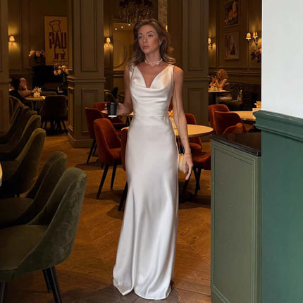 Women Fashion French Style Sleeveless V-Neck Dress worn by a model in a chic restaurant setting, showcasing elegance and style.