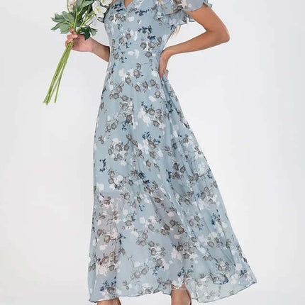 Women Floral Short Sleeve V Neck Beach Maxi Dress in blue with floral patterns, worn by a woman holding flowers.