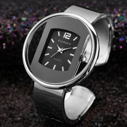 Women Watches Luxury Brand Quartz Dial Dress Bracelet featuring a sleek black quartz dial and metallic bracelet.