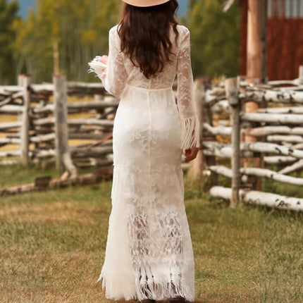 Womens Boho Lace Maxi Dress With Tassels, back view showcasing intricate lace design and tassels in a natural outdoor setting.